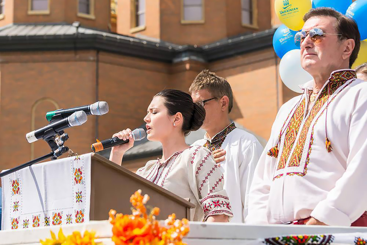 Julie singing at a church gathering