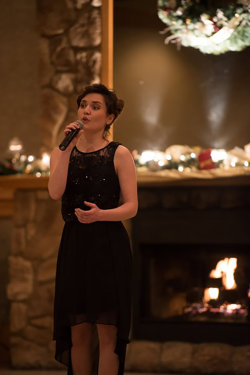 Julie singing at a special event